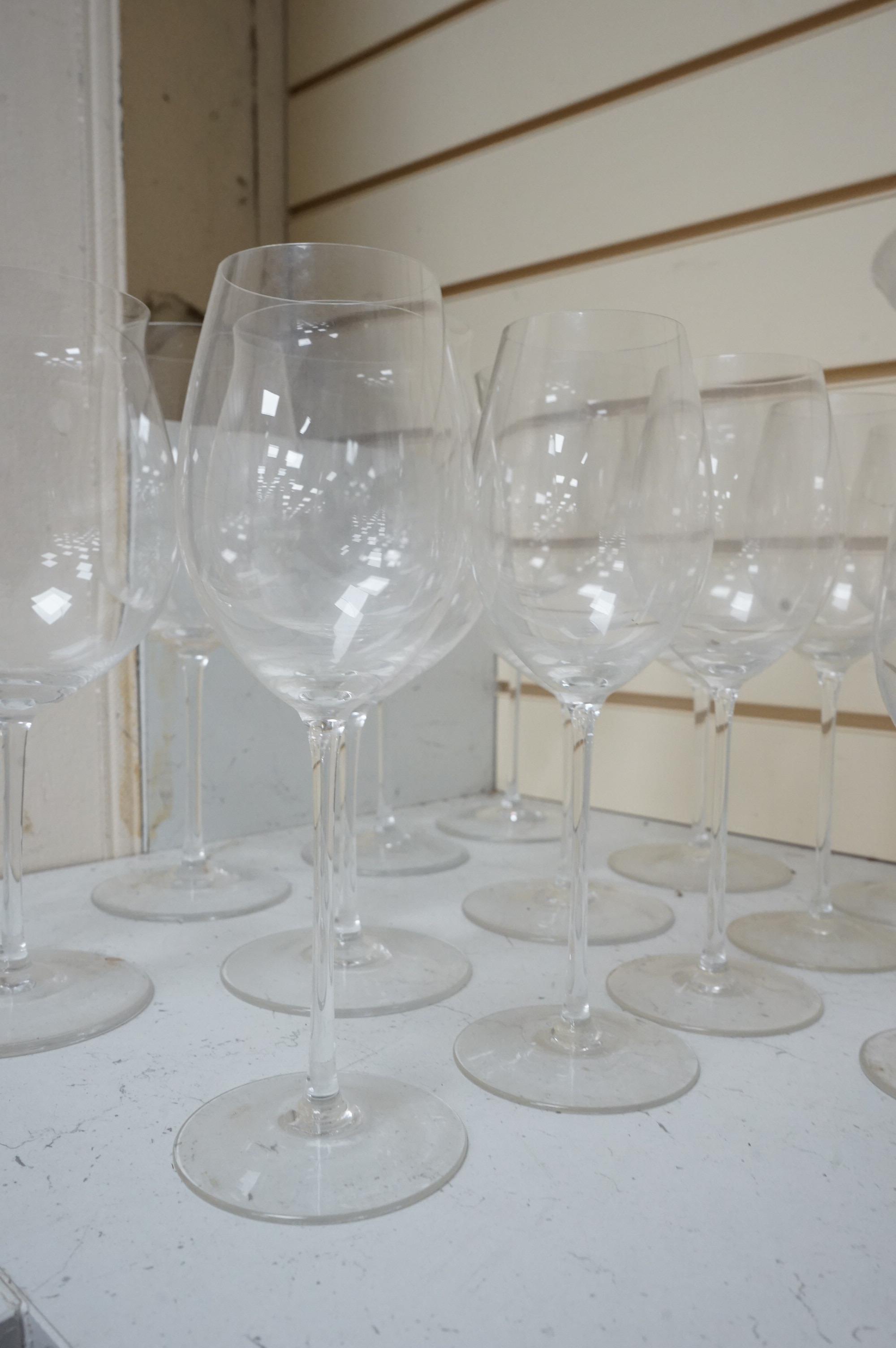 A Pierre Frey ‘Gonesse’ Limoges part dinner service, two Villeroy and Boch ‘Jardins Francais’ dinner plates, with a collection of Riedel wine glasses and mixed Salviati champagne glasses. Villeroy and Boch plates 30.5cm